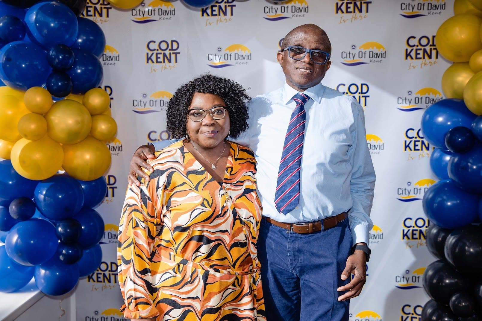 A couple at the COD KENT photo wall